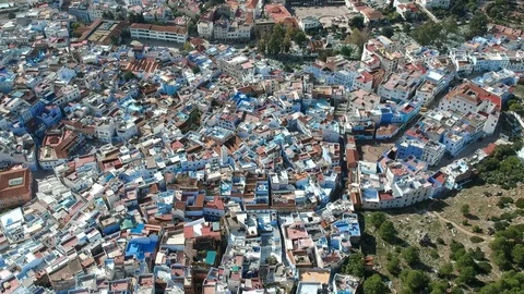Flying over Chefchaouen and a blue city in Morocco with Drone from above (Aerial Stock Footage 101342683