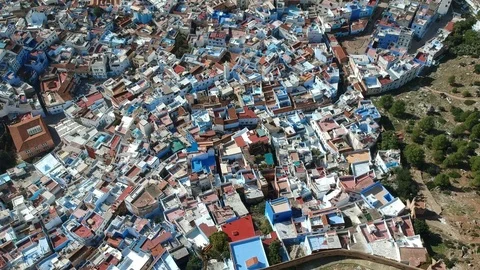 Flying over Chefchaouen and a blue city in Morocco with Drone from above (Aerial Stock Footage 101342749