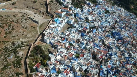 Flying over Chefchaouen and a blue city in Morocco with Drone from above (Aerial Stock Footage 101342886