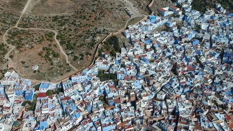 Flying over Chefchaouen and a blue city in Morocco with Drone from above (Aerial Stock Footage 101343054