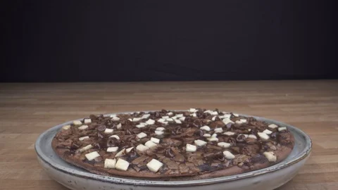 Flying over chocolade dish on table pizza with macro lens Stock Footage 124017061