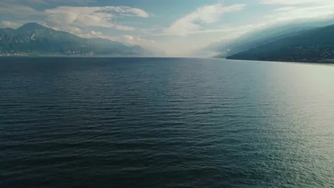 Flying over cinematic beautiful landscape natural sea floating surrounded by Stock Footage 159627306