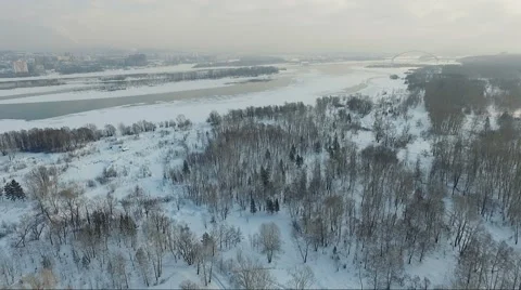 Flying over the city. City river in winter. Bridge over river Stock Footage 60763853