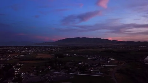 Flying over the city during sunset Stock Footage 112674475