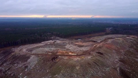 Flying over the City Garbage Dump and factories in the background. Video stock 143614717