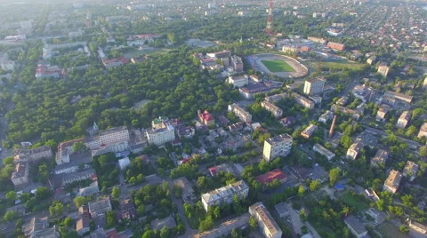 Flying over the city at sunset Stock Footage 67627447