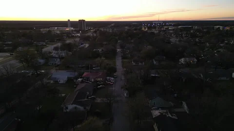 Flying Over The City At Sunset With The Sun In Front Of You Stock Footage 296664530