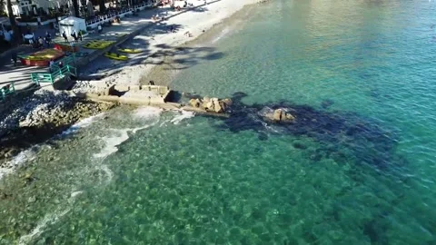 Flying over clear ocean beach Stock Footage 175079369