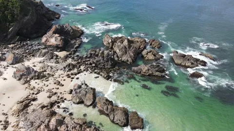 Flying over clear ocean waters with rocks Stock Footage 148199172