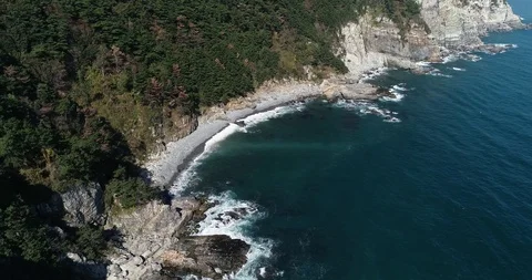 Flying over the cliff and coast of the Taejongdae scenic spot in Busan Stock Footage 100968097