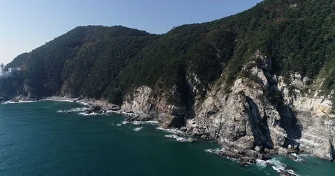 Flying over the cliff and coast of the Taejongdae scenic spot in Busan Stock Footage 100968196