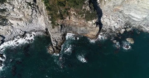 Flying over the cliff and coast of the Taejongdae scenic spot in Busan Stock Footage 100968204
