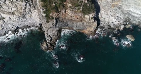Flying over the cliff and coast of the Taejongdae scenic spot in Busan Stock Footage 100968230