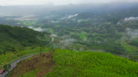 Flying over the Cliff, Clouds, above the mountains in a high altitude Da Na.. Video stock 235815471