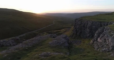 Flying over cliff edge and valley Video stock 87037125
