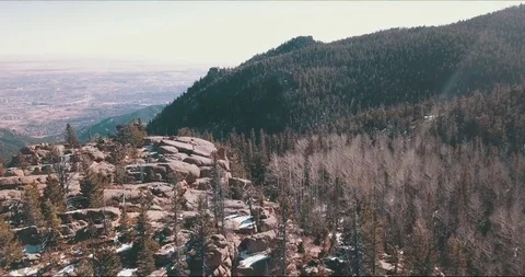 Flying over cliffs, mountains and looking into city Video stock 84339792