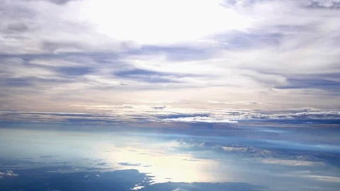 Flying over the clouds with the afternoon sun. Flight with beautiful lens flare Stock Footage 92740756