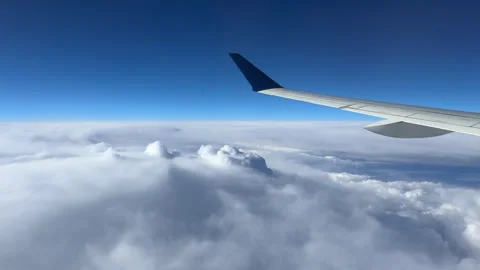 Flying over clouds against blue sky Stock Footage 333646129