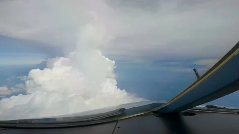 Flying over clouds airplane cokcpit view Stock Footage 231657974
