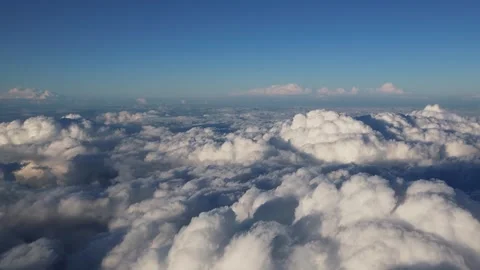 Flying over clouds in an airplane Stock Footage 317726754