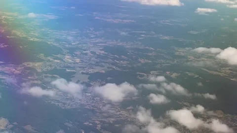 Flying over clouds and land Stock Footage 343534934