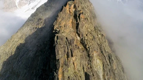 Flying over the clouds and mountain peaks Stock Footage 121745730