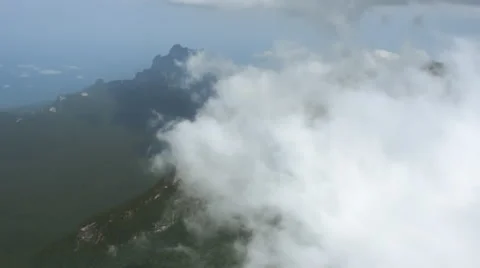 Flying over the clouds and mountains Stock Footage 52357488