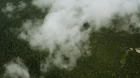 Flying over the clouds and the rainforest Stock Footage 52357729