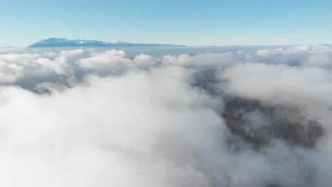 Flying over clouds and view of High Tatra from Beskid Mountains Stock Footage 143990126