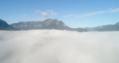 Flying over the clouds, Austrian Alps, Austria Stock Footage 98837715