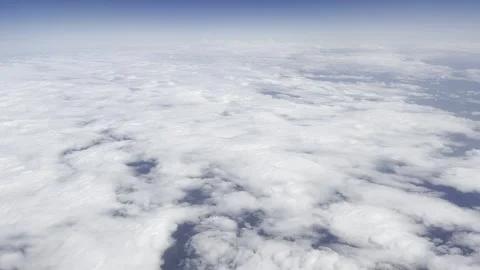 Flying over the clouds, bright cloudscape Stock Footage 240494125