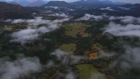 Flying over the clouds during autumn Stock Footage 166341728