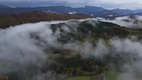 Flying over the clouds during autumn Stock Footage 166341885
