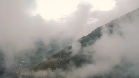 Flying over of the clouds inside Canyon del Colca in the Andes Mountains in Peru Stock Footage 197266089