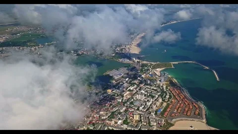 Flying over the clouds in Mamaia , Black Sea Coast, Romania Video stock 97563441