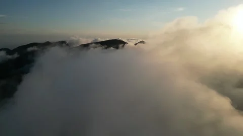 Flying over the clouds on the mountain 库存影片 300286125