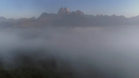 Flying over the clouds in mountain valley in georgia. Aerial camera shot. fog Stock Footage 99813867