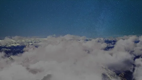 Flying over clouds night time-lapse | Loop 스톡 동영상 80963572