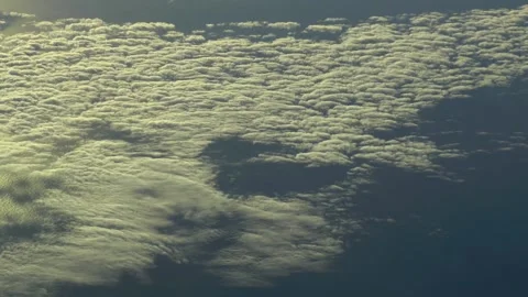 Flying over the clouds, over the ocean. Aerial footage. Stock Footage 146079004