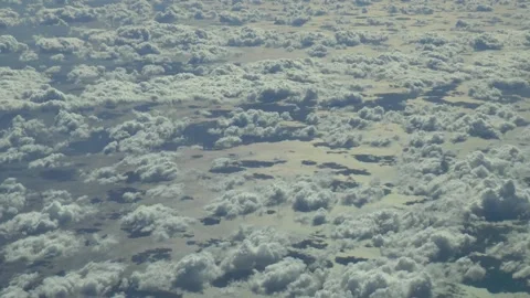 Flying over the clouds, over the ocean. Aerial footage. Vídeos de archivo 163771966