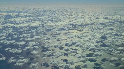 Flying over the clouds, over the ocean. Aerial footage. Vídeos de archivo 164001109