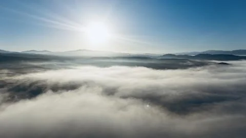 Flying over the clouds Stock Photos