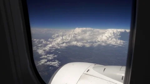 Flying over the clouds in a plane aircraft Stock Footage