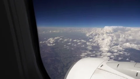 Flying over the clouds in a plane aircraft Stock Footage 78385014
