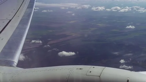 Flying over the clouds in a plane aircraft Stock Footage 79595815