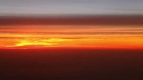 Flying over clouds in the sky at sunset Stock Footage 167337839