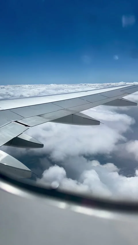 Flying over clouds on a sunny day Stock Footage 277084724