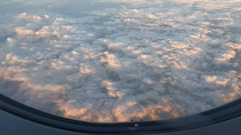 Flying over the clouds at sunrise Vídeo Stock 235598018