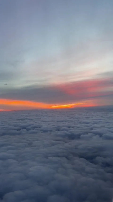 Flying over the clouds at sunrise Stock Footage 294240460
