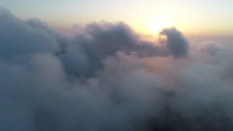Flying over the clouds at sunset - 1 Video stock 145875683